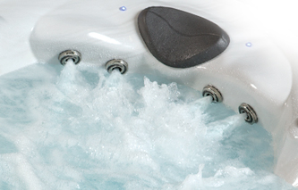 Woman in hot tub enjoying the stress relief neck and shoulder jets 